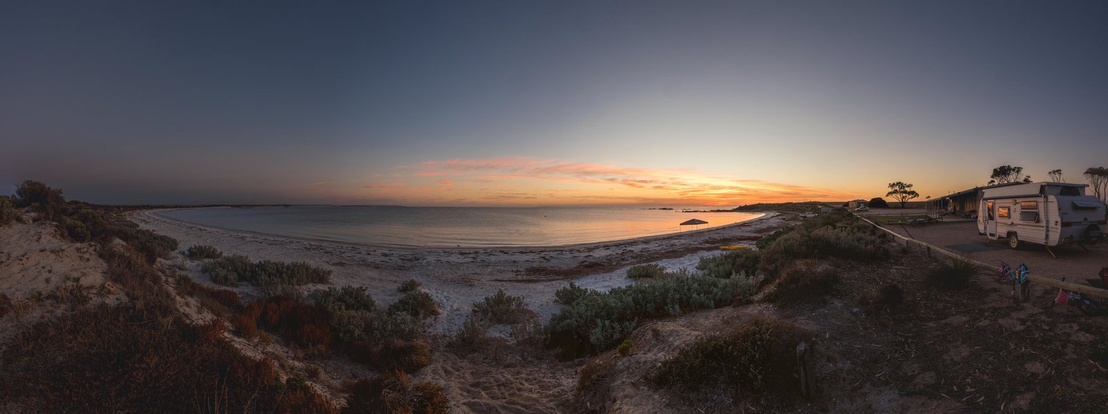 Sunset over the beach at Redcliff Campsite